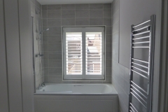Waterproof Shutter Fitted Over Shower and Bath in Bathroom