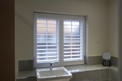 White Shutters in Bathroom Window