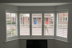 White Plantation Shutters Fitted to Angled Bay Window in Lounge