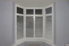 Small Angled Bay Window with White Shutters