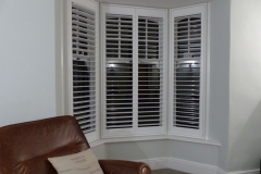 White Window Shutters Fitted to Small Angled Bay