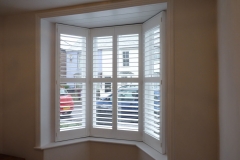 Small Angled Bay Window with White Shutters