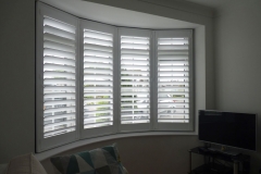 Round Living Room Bay Window with White Shutters