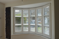 Round Bay with White Window Shutters