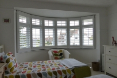 Large Round Bay Window with Shutters in Bedroom