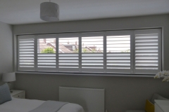 Wide Bedroom Window with Split Tilt Shutters