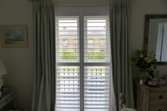Plantation Shutters with Middle Rail Fitted in Bedroom