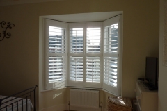 Small Angled Bay Window Fitted with Shutters in the Bedroom