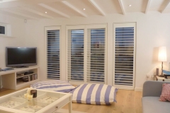 Stylish full height shutters fitted over doors