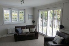 Shutters Fitted to Shallow Angled Bay Window and Patio Doors In Living Room