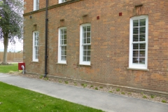 Row of Windows with White Internal Shutters Fitted