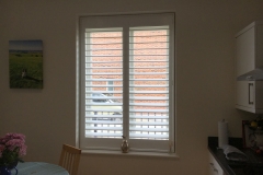 Tall White Wooden Shutters in Kitchen