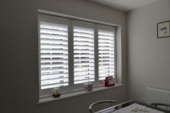 White Plantation Shutters Fitted to Three Panel Window in Kitchen Dining Room