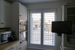 Tall Kitchen Window with White Shutters Fitted