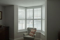 White Shutters Fitted to Small Angled Bay Window in Living Room