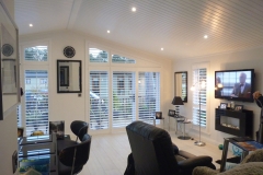 Shaped Patio Door Shutters in Living Area