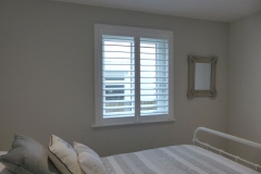 Full Height White Plantation Shutters in Bedroom