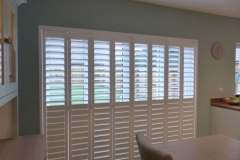 Tracked Plantation Shutter Doors with Split Tilt and Top Louvres Open
