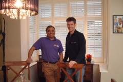 Sam and Billy in front of bay shutters from DIY SOS