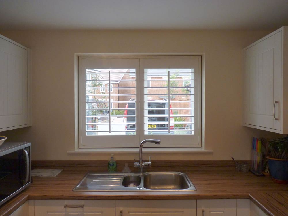 Fauxwood kitchen shutters with shadow gap