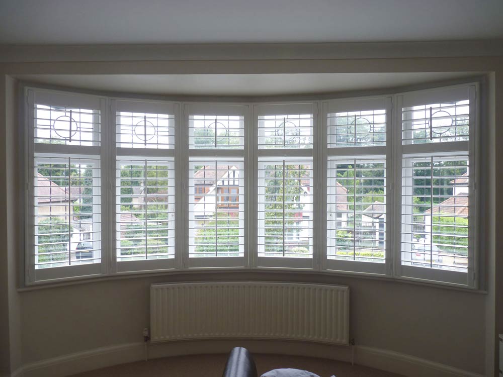 Round bedroom upvc bay and matching plantation shutters