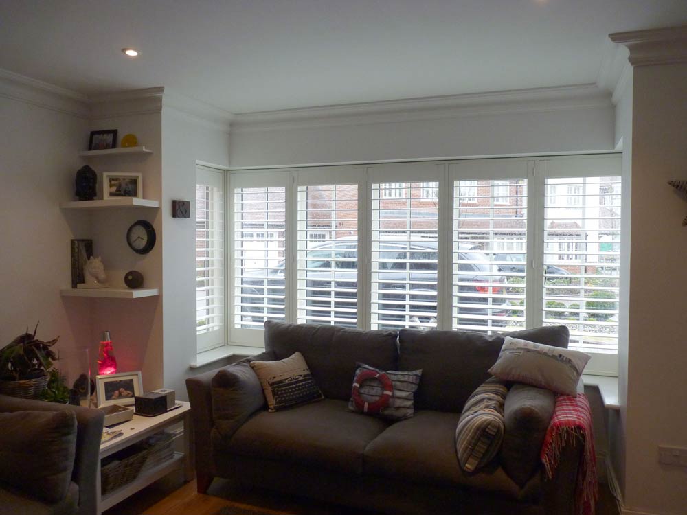 Modern lounge square bay fitted with shutters and tposts