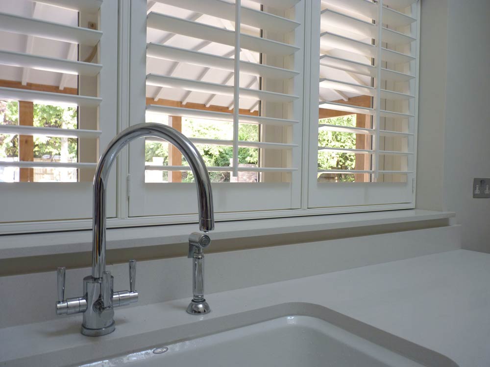Utility shutters fitted behind a tap