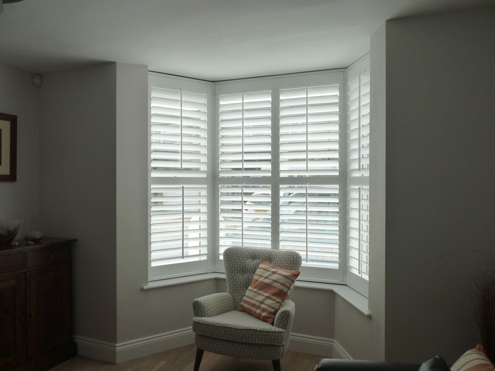 White Shutters Fitted to Small Angled Bay Window in Living Room