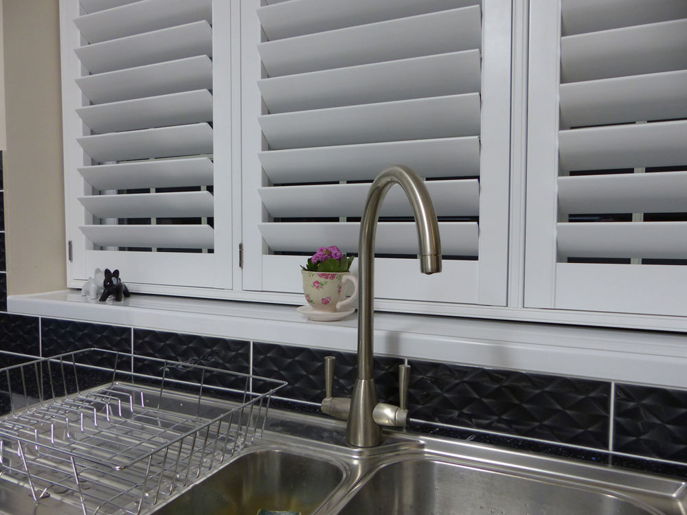 Close Up of TPost Shutters Over Kitchen Sink Close Up of TPost Shutters Over Kitchen Sink