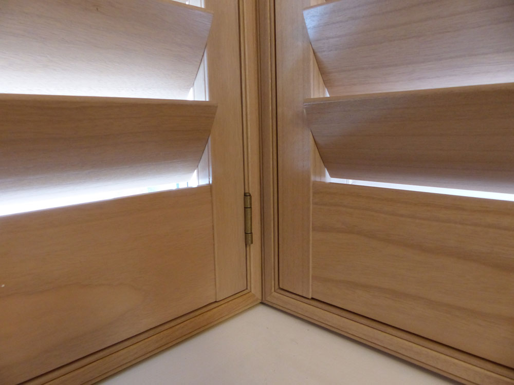 Close Up of Natural Wood Shutters in Square Bay