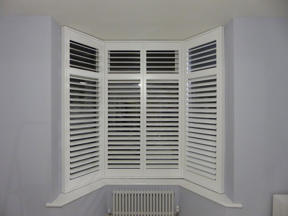 Small Angled Bay Window with White Shutters