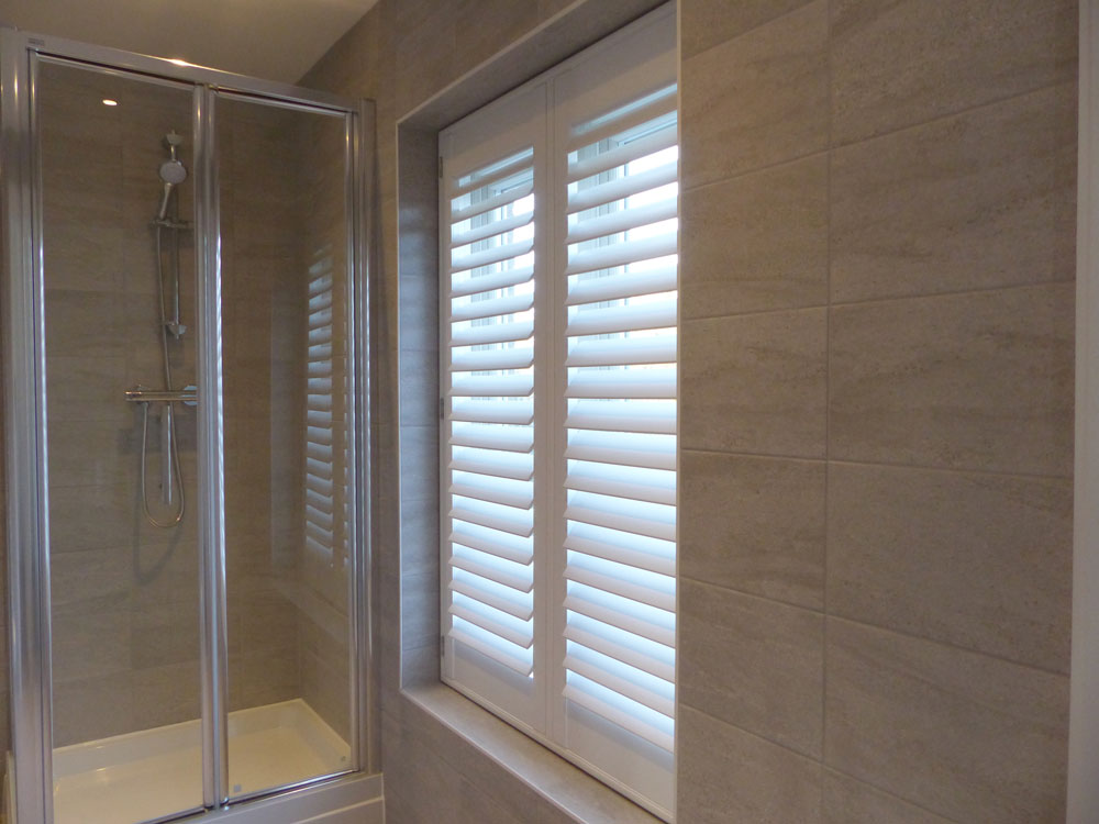 Tall Bathroom Window Fitted with Waterproof Shutters
