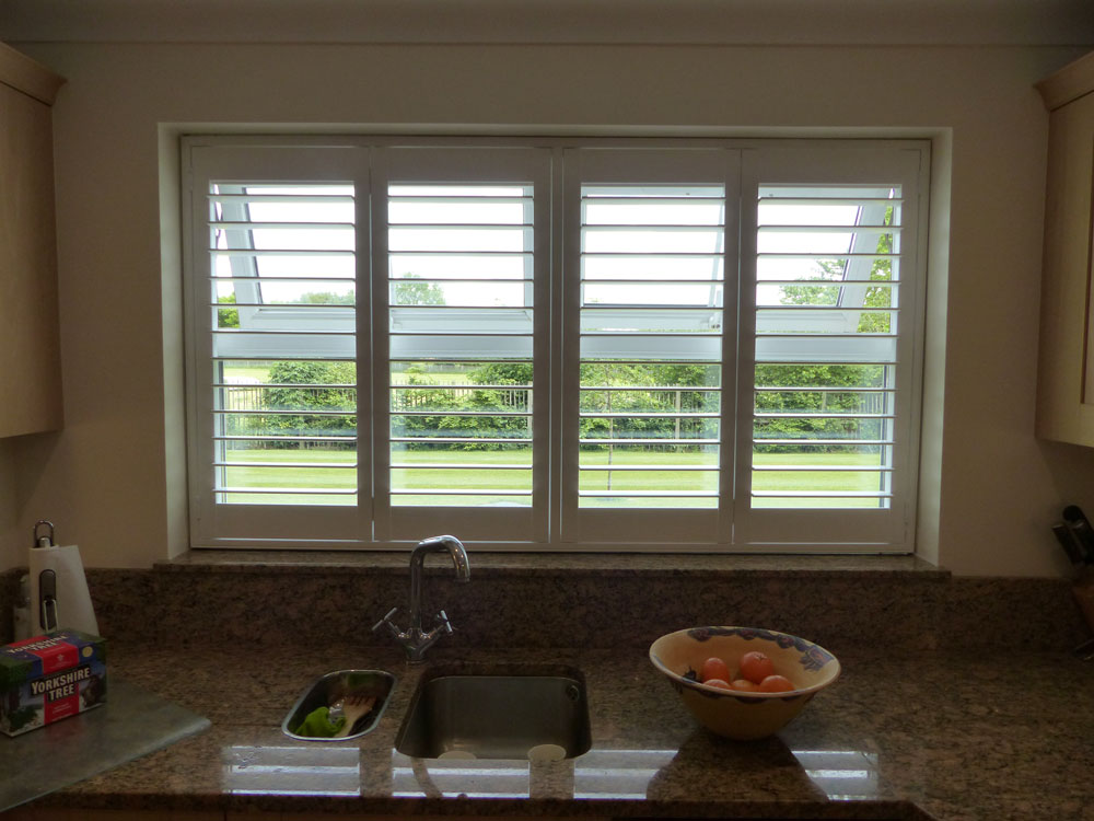 Full Height Plantation Shutters in Four Panel Window in Kitchen