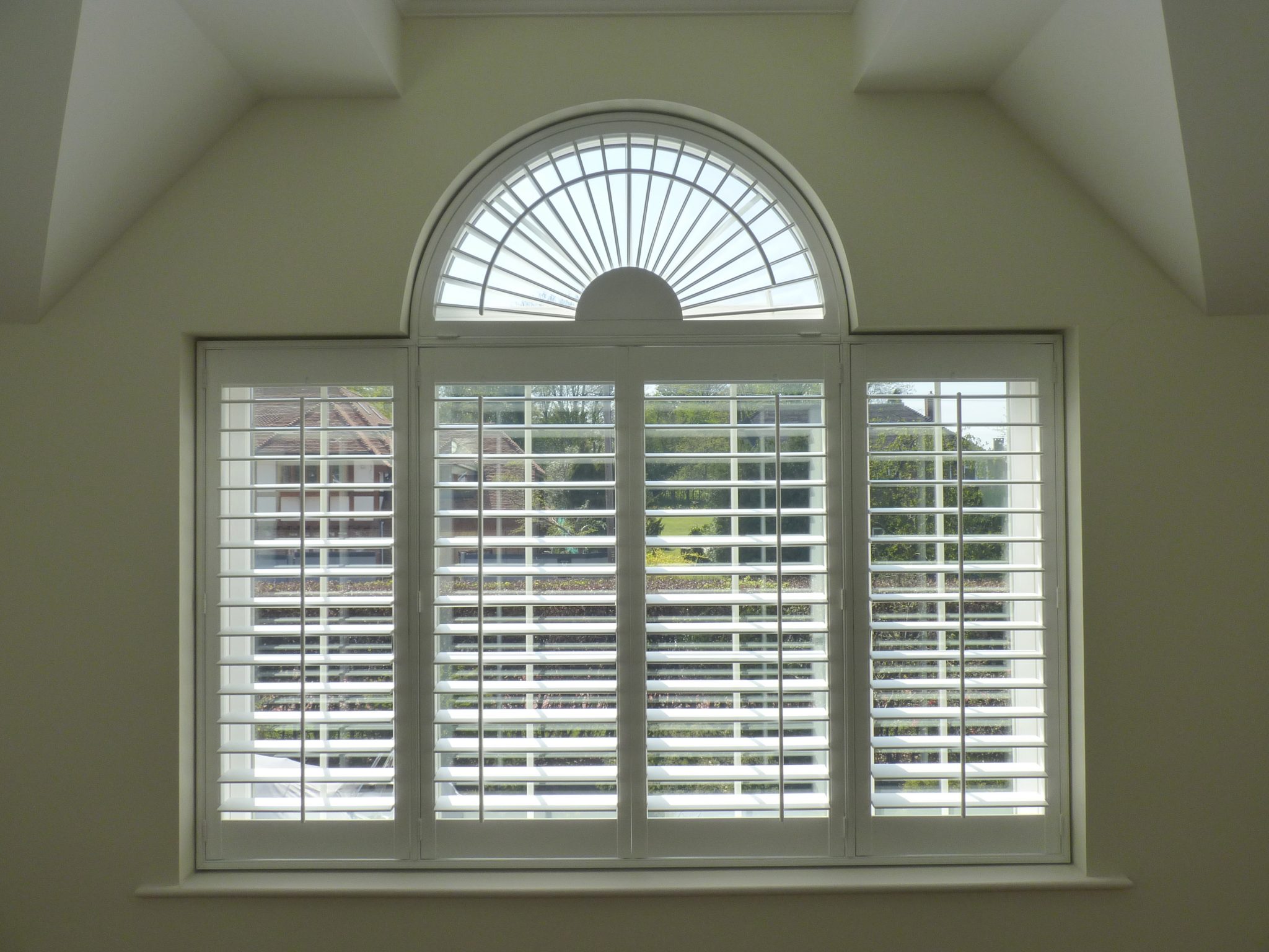 Fan Shaped Window with Louvered Shutters Fitted