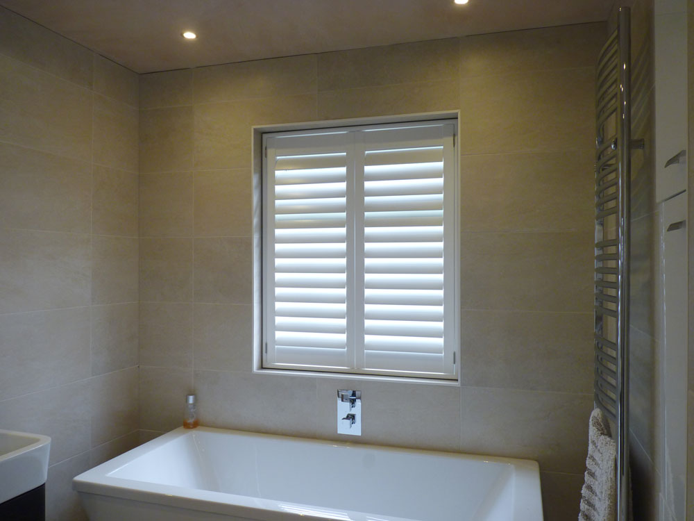 Waterproof Shutters Fitted in Window over Bath in Bathroom Waterproof Shutters Fitted in Window over Bath in Bathroom