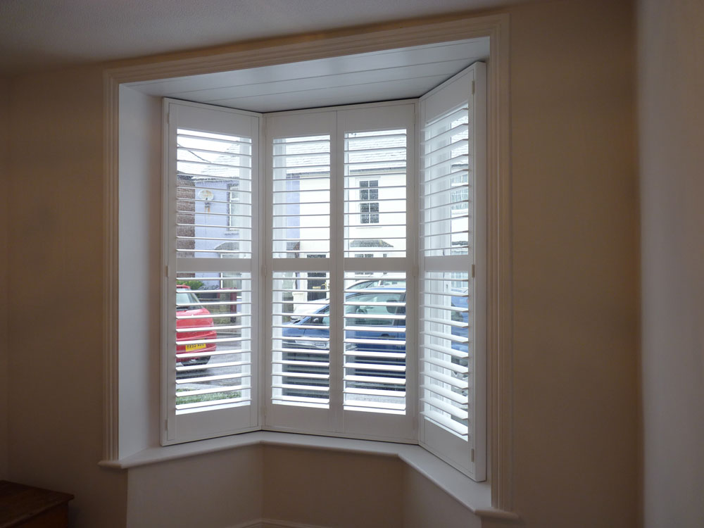 Small Angled Bay Window with White Shutters