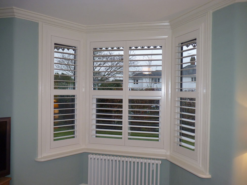 Shutters with Middle Rail Fitted to Angled Bay Window